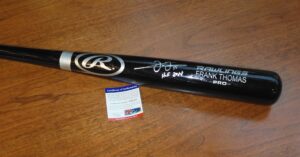Frank Thomas signed bat in protective tube with certificate of authenticity.