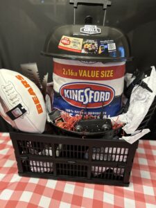 Bears Grill Raffle Basket #10 -travel grill, BBQ tool set (tongs, spatula, fork), bag of charcoal, drone (has batteries and ready to fly), tablecloth